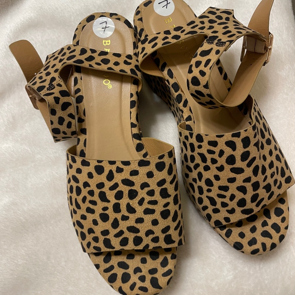 NWOT boutique cheetah wedge heels